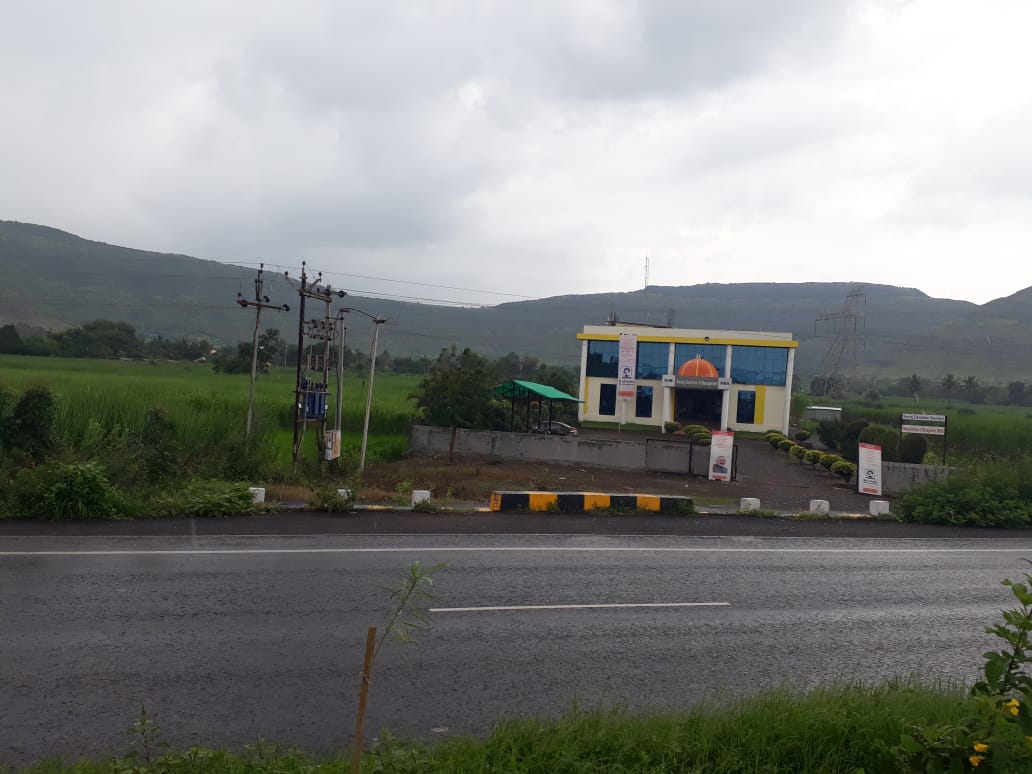 Wide exterior view of Swaraj Institute from across the road