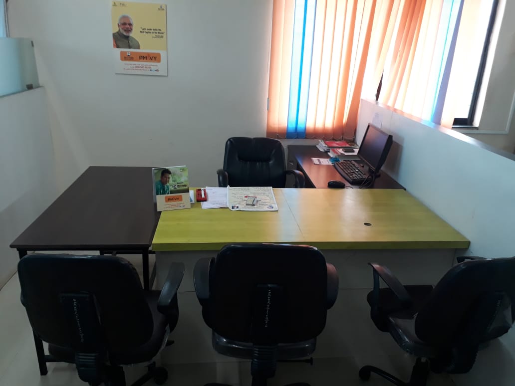 Office desk and meeting chairs in an institute cabin